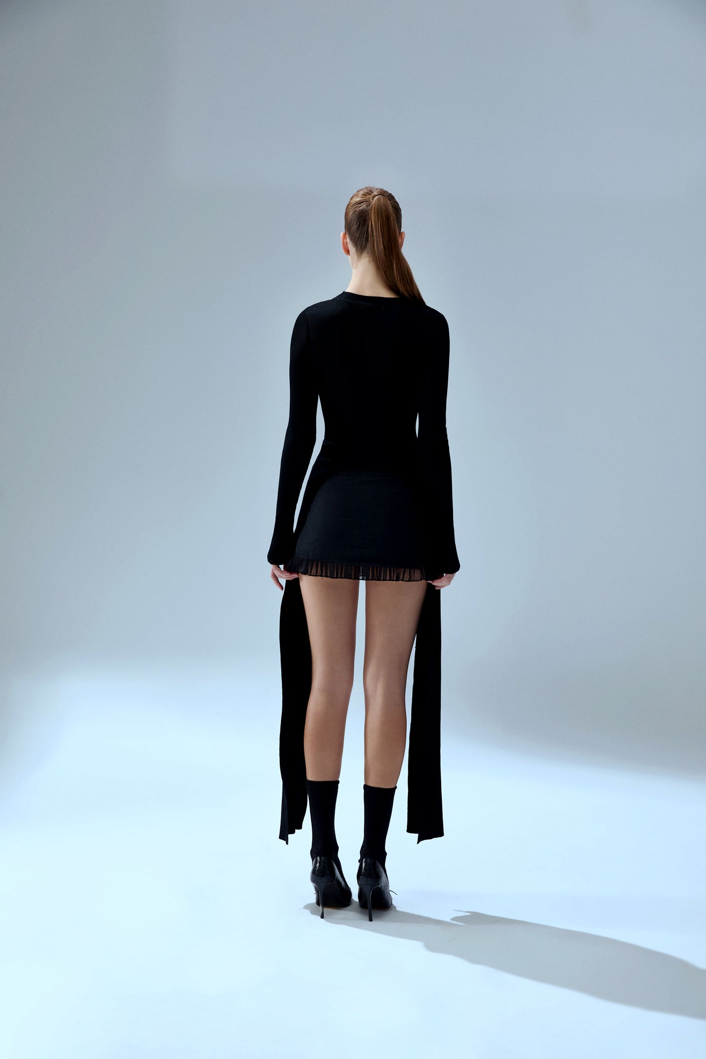 Your *itch Tailed Knit Top